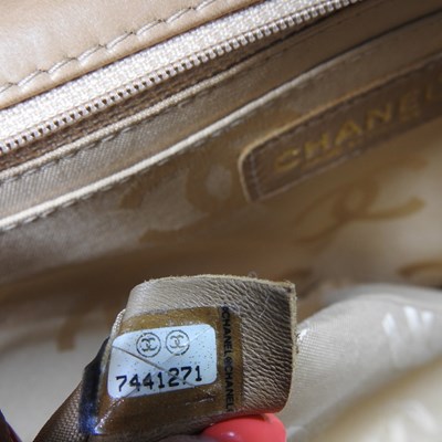 Lot 4 - A Chanel Choco Bar clutch bag, in caramel...