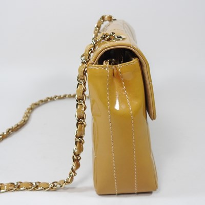 Lot 4 - A Chanel Choco Bar clutch bag, in caramel...