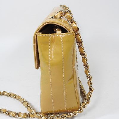 Lot 4 - A Chanel Choco Bar clutch bag, in caramel...
