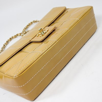 Lot 4 - A Chanel Choco Bar clutch bag, in caramel...