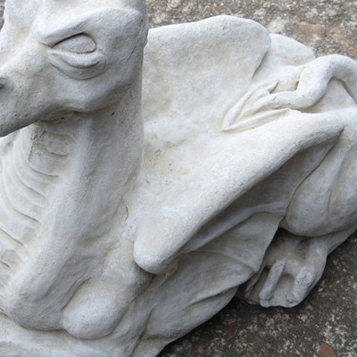 Lot 63 - A cast stone garden model of a dragon, 47cm high