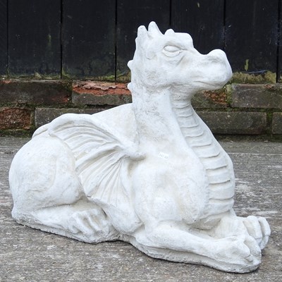 Lot 63 - A cast stone garden model of a dragon, 47cm high