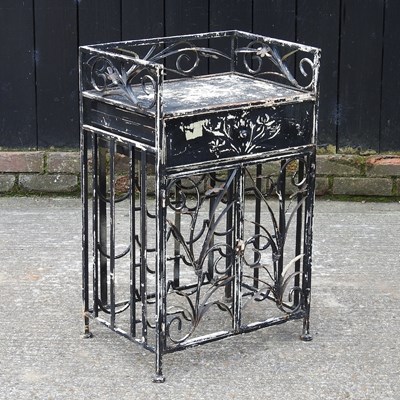 Lot 450 - A black painted iron wine rack