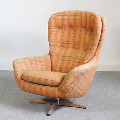 Lot 313 - A 1970's orange check upholstered swivel egg...