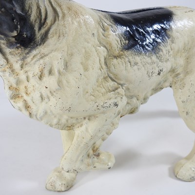 Lot 15 - A painted cast iron door stop, in the form of...
