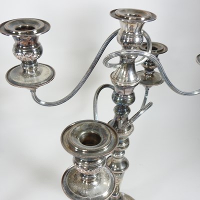Lot 167 - A pair of silver plated four branch table...