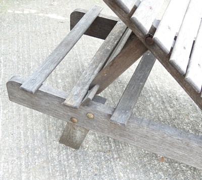 Lot 43 - A teak adjustable garden lounger, 183cm long