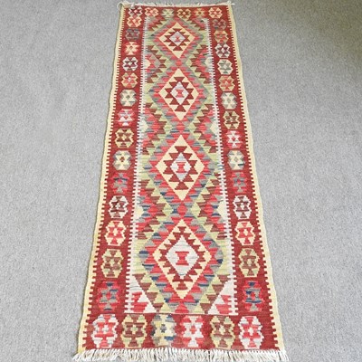 Lot 491 - A Persian kelim runner, with a row of four...