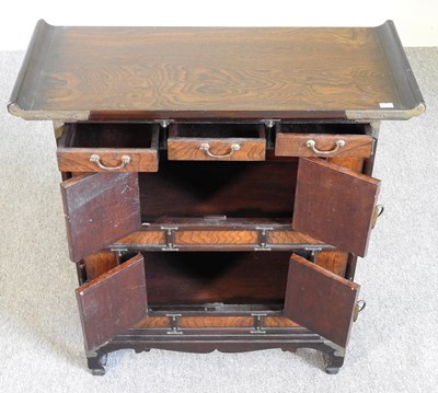 Lot 22 - A small Chinese elm cabinet, with drawers and...