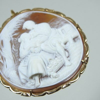 Lot 65 - A cameo brooch, of circular shape, carved with...