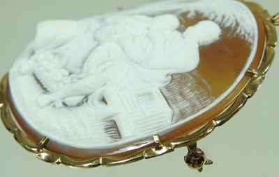 Lot 65 - A cameo brooch, of circular shape, carved with...