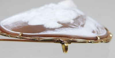 Lot 65 - A cameo brooch, of circular shape, carved with...