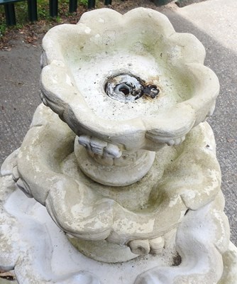 Lot 44 - A cast stone four tier garden fountain, of...