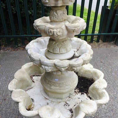 Lot 44 - A cast stone four tier garden fountain, of...