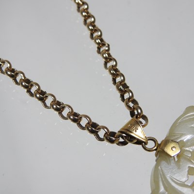 Lot 42 - A Chinese jade pendant, fret carved with two...