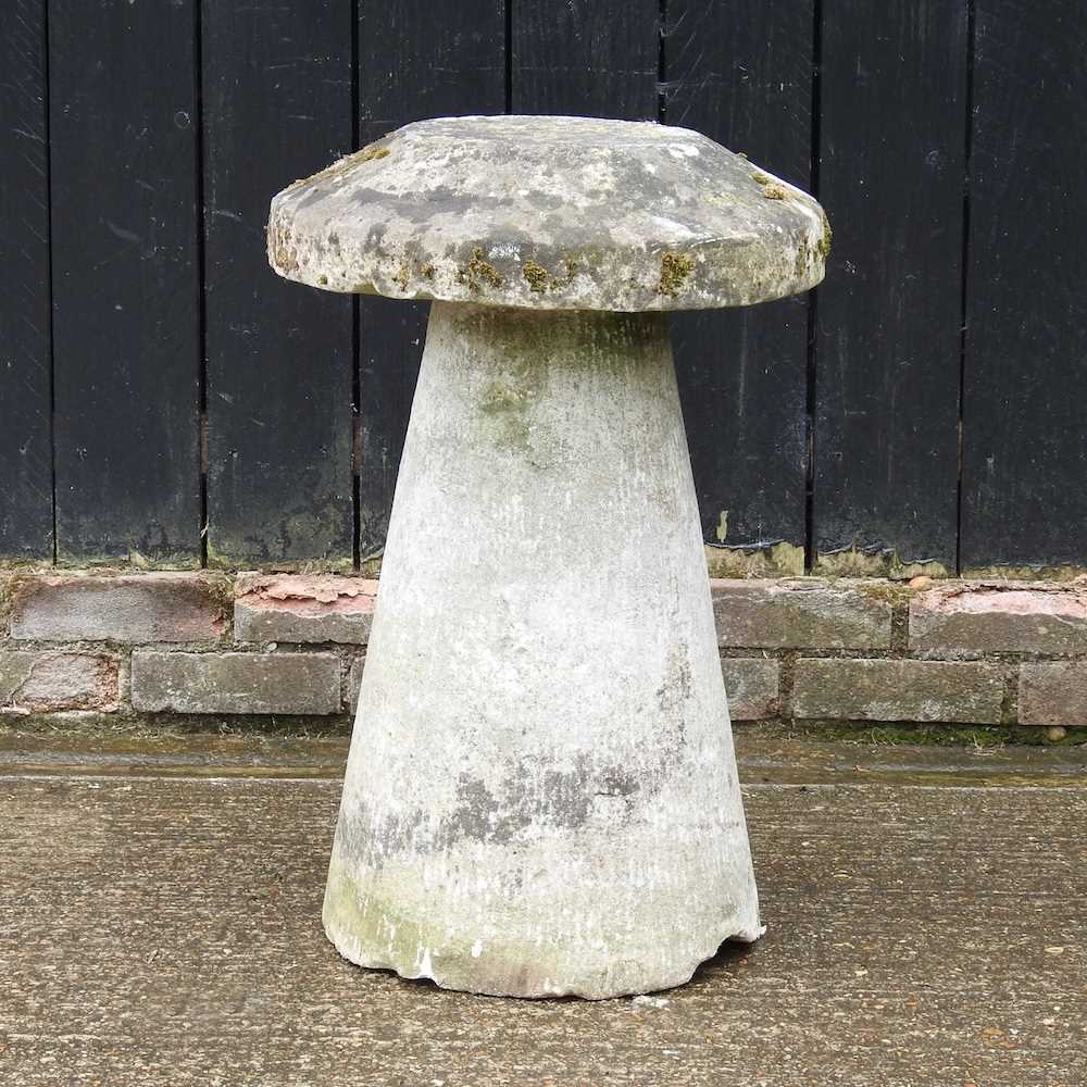 Lot 7 - A cast stone staddle stone, 72cm high