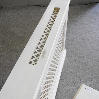 Lot 105 - A pair of white painted wooden radiator covers...
