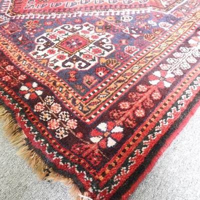 Lot 120 - A Persian Shiraz rug, with a central hooked...