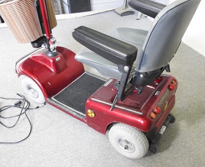 Lot 84 - A red Shoprider electric mobility scooter,...
