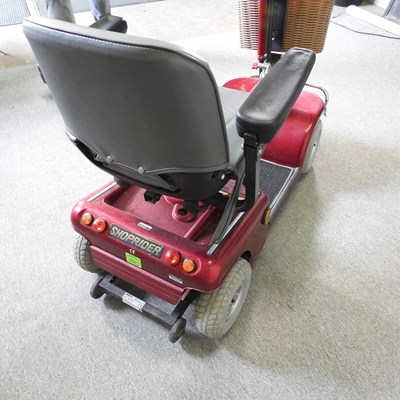 Lot 84 - A red Shoprider electric mobility scooter,...