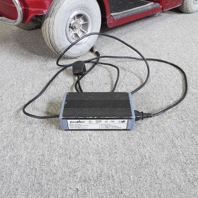 Lot 84 - A red Shoprider electric mobility scooter,...