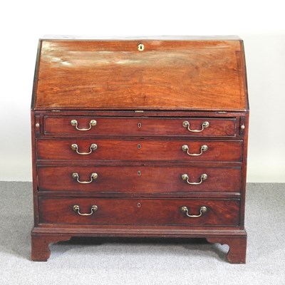 Lot 551 - A George III mahogany bureau, with a fitted...