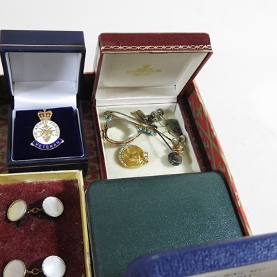 Lot 111 - A 15 carat gold locket, together with a...