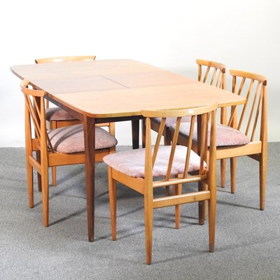 Lot 85 - A 1970's teak extending dining table, together...
