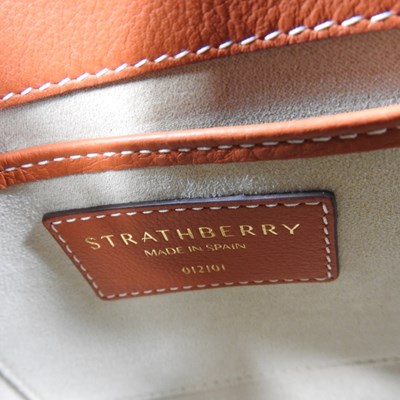 Lot 25 - A Strathberry nano tote bag in maple and...