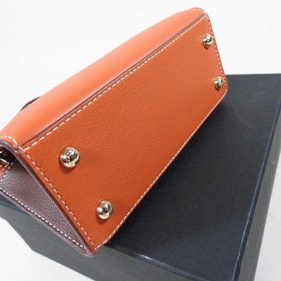 Lot 25 - A Strathberry nano tote bag in maple and...
