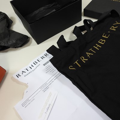 Lot 25 - A Strathberry nano tote bag in maple and...