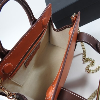 Lot 25 - A Strathberry nano tote bag in maple and...
