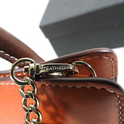 Lot 25 - A Strathberry nano tote bag in maple and...