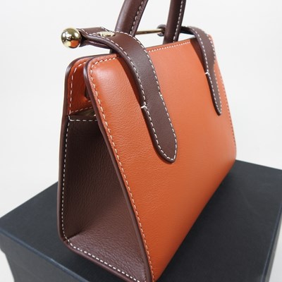 Lot 25 - A Strathberry nano tote bag in maple and...