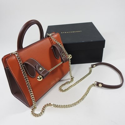 Lot 25 - A Strathberry nano tote bag in maple and...