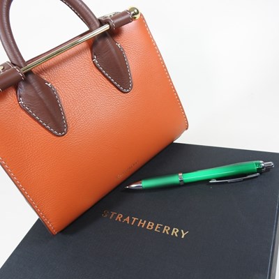 Lot 25 - A Strathberry nano tote bag in maple and...