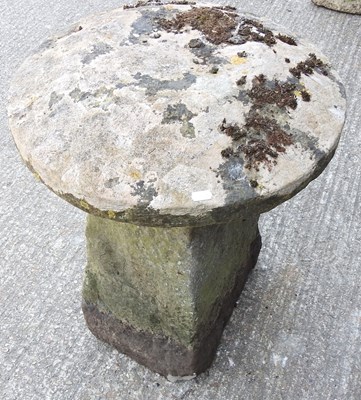 Lot 26 - A carved stone staddle stone, 64cm high