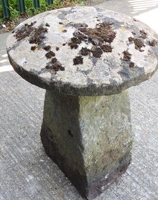Lot 26 - A carved stone staddle stone, 64cm high