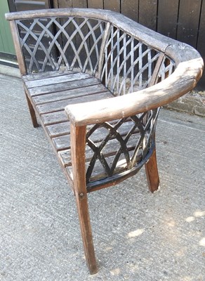 Lot 297 - A wooden garden bench, with a lattice back,...