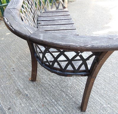 Lot 297 - A wooden garden bench, with a lattice back,...