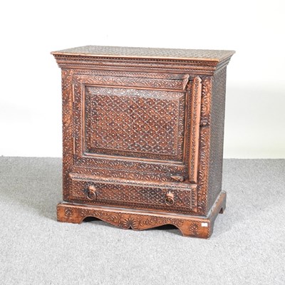 Lot 111 - An eastern carved hardwood side cabinet
