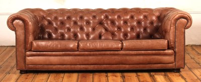 Lot 37 - A tan leather buttoned upholstered...