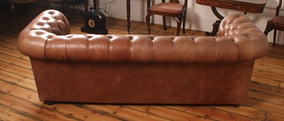 Lot 37 - A tan leather buttoned upholstered...