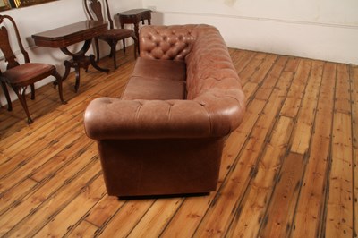 Lot 37 - A tan leather buttoned upholstered...