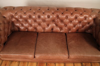 Lot 37 - A tan leather buttoned upholstered...