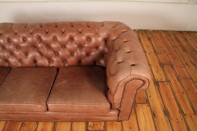 Lot 37 - A tan leather buttoned upholstered...