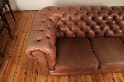 Lot 37 - A tan leather buttoned upholstered...