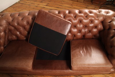 Lot 37 - A tan leather buttoned upholstered...