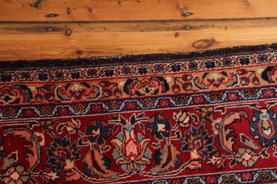Lot 14 - A large Persian Tabriz woollen rug, the...