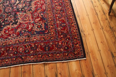 Lot 14 - A large Persian Tabriz woollen rug, the...